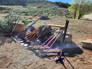 Trail maintenance tools awaiting use on a new section of trail at Durango Mesa Park.